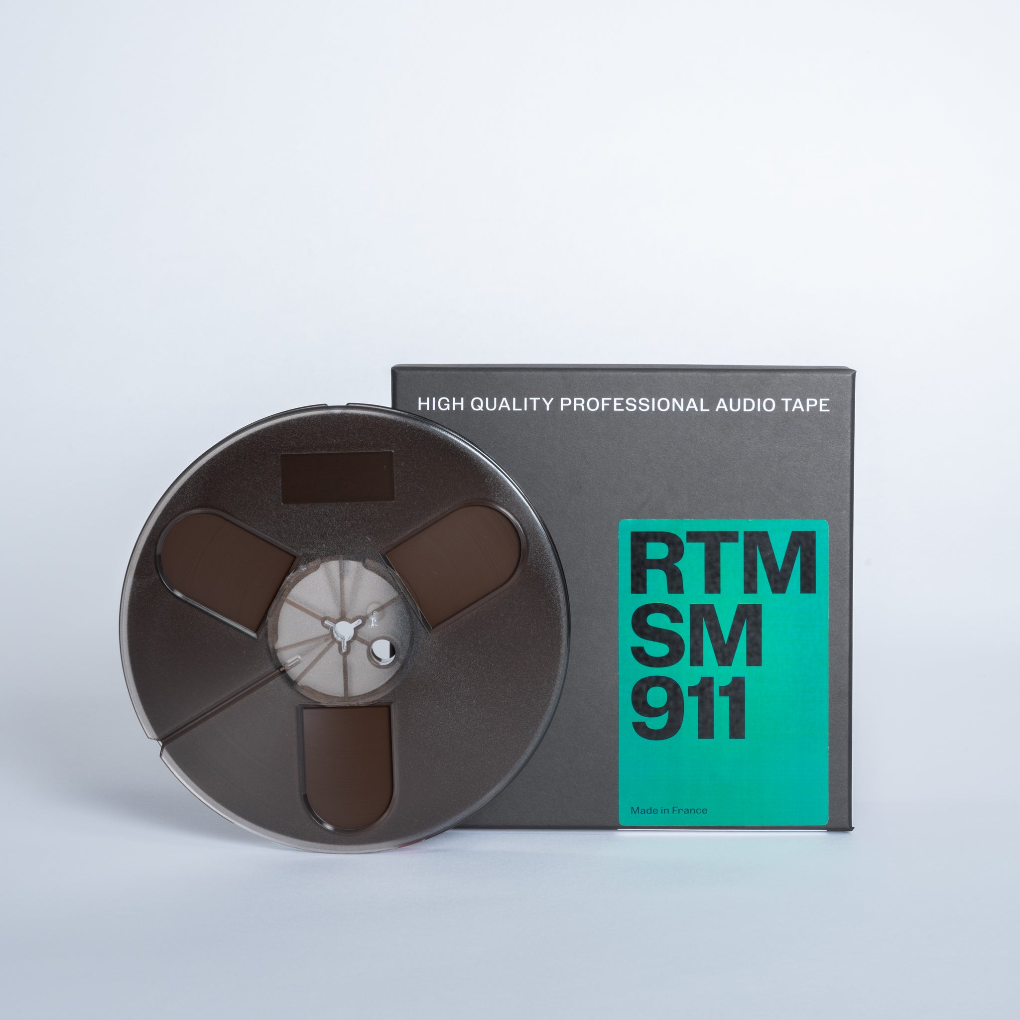 1/4 SM911 Tape on 7 inch plastic reel in cardboard box –
