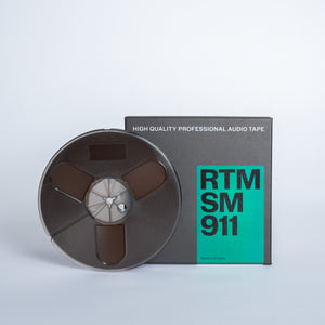 1/4" SM911 Tape on 7 inch plastic reel in cardboard box